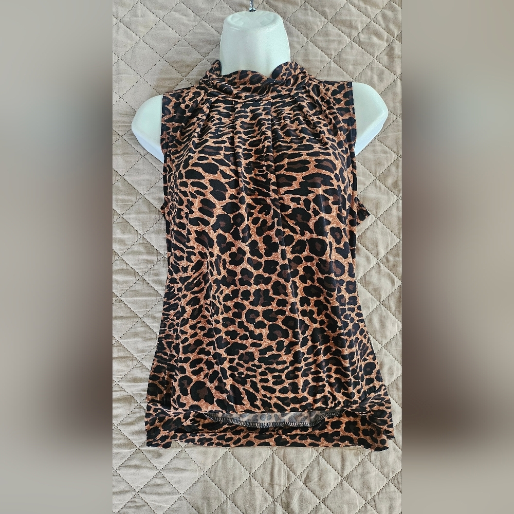 Women's size medium sleeveless shirt,  cheetah print, used